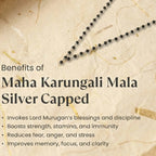 Black beaded necklace on a textured beige background with text about Maha Karungali Mala Silver Capped