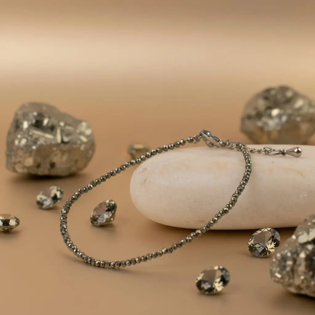 Delicate bracelet on a stone with candles and flowers in the background